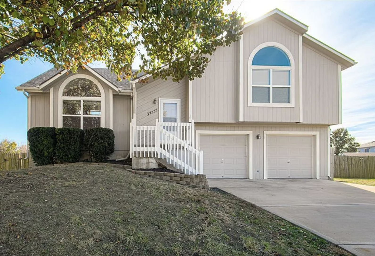 Modern house with two-car garage.